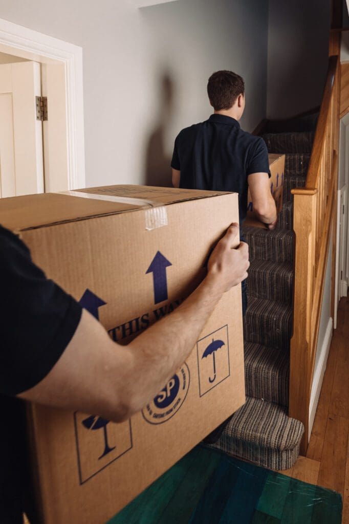 men carrying a box