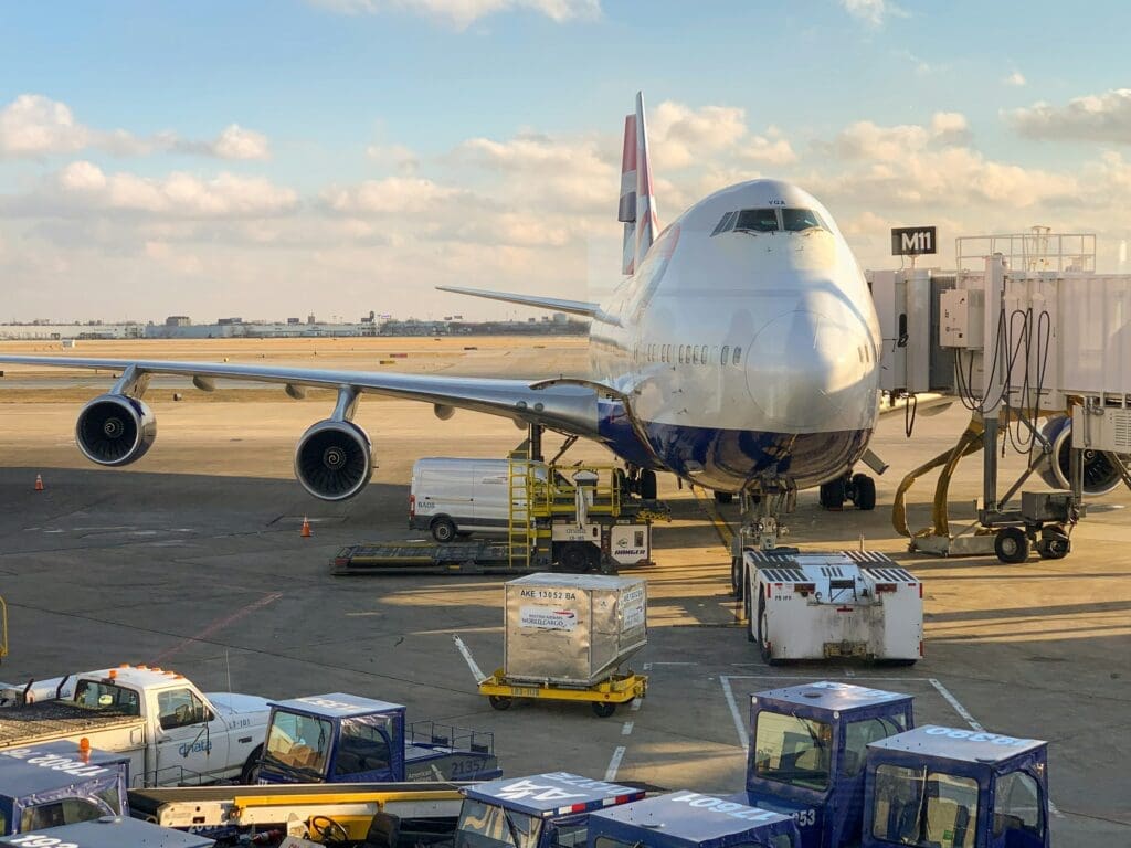 an airplane loading on container cargos