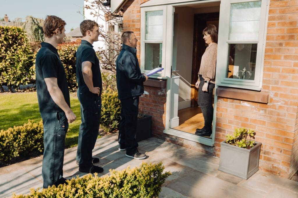 Three men pay a visit for a moving survey